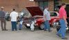 Checking out the cars...and the dolls. Image